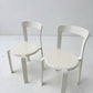 Set of two white Poli model 3700 stacking chairs from Dietiker 1993s